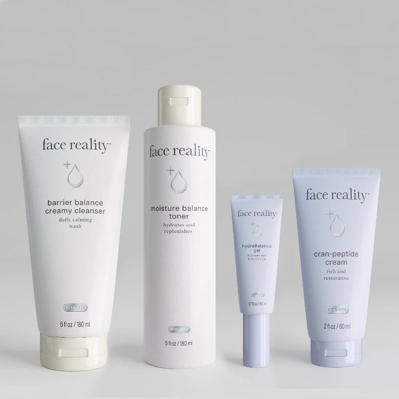 Set of 'face reality' skincare products on a light gray background