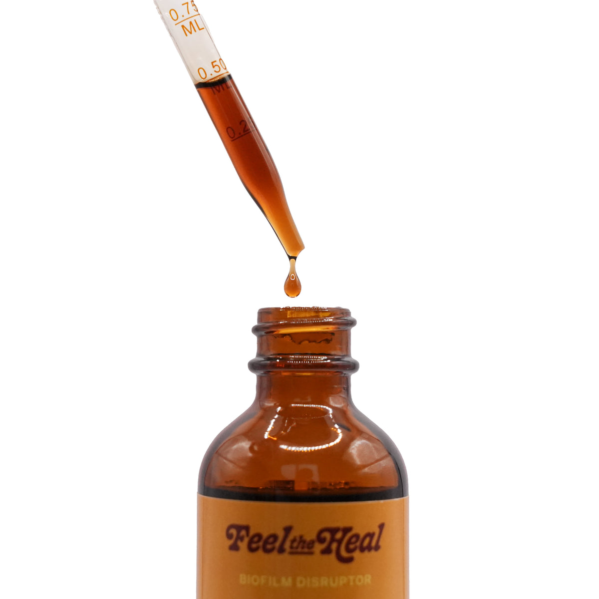 Brown bottle labeled 'Feel the Heal' with a dropper dispensing liquid.