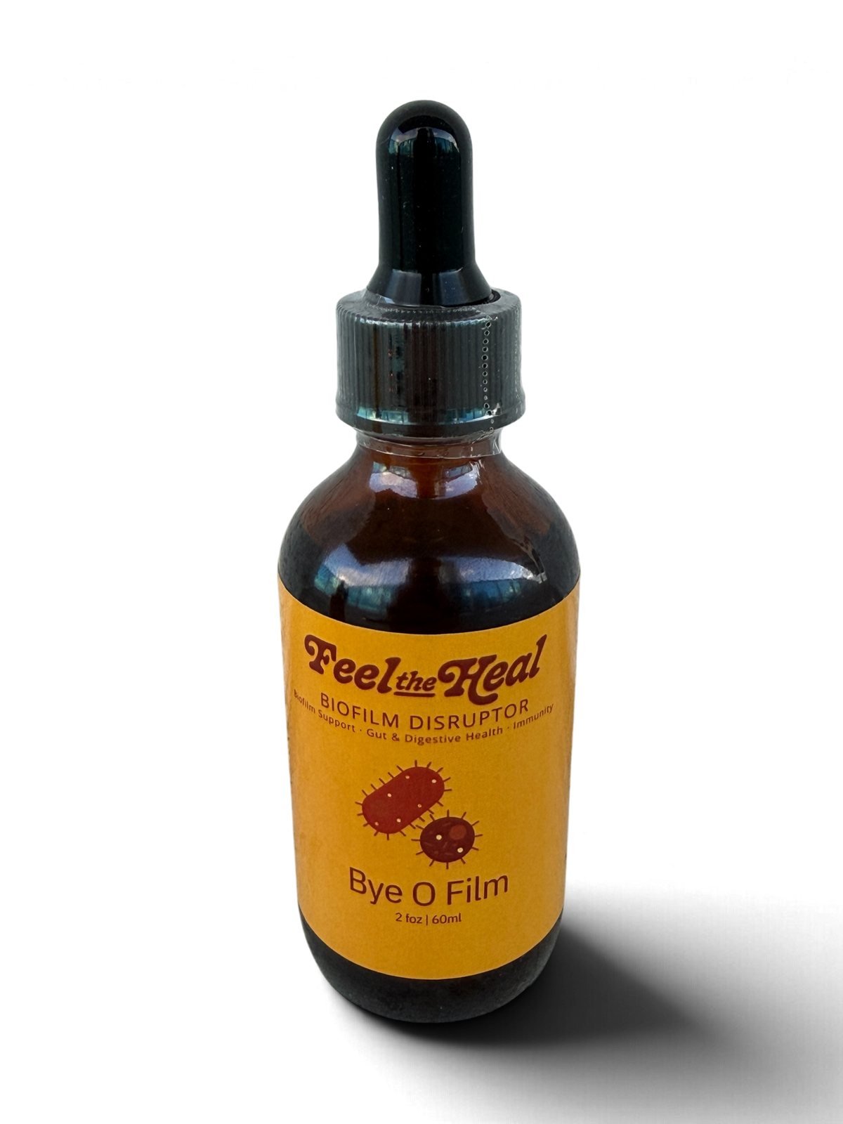 An amber glass dropper bottle with a black cap and a yellow label reading 'Feel the Heal' and 'Bye O Film', photographed on a white background with a soft shadow.
