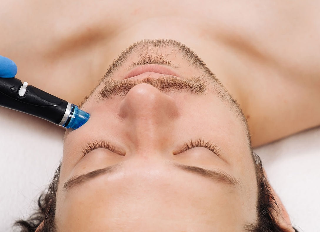Person receiving a facial treatment with a device on their face