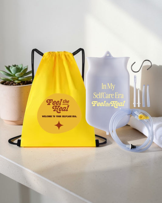 Yellow drawstring bag and self-care era product on a white surface with a plant in the background.